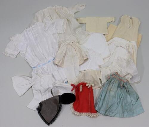 A good collection of dolls clothes,