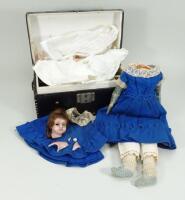 A poured wax shoulder head doll with trunk and clothing, English circa 1860,