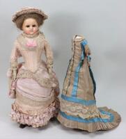 A good wax over composition shoulder head doll in original clothes, circa 1860,