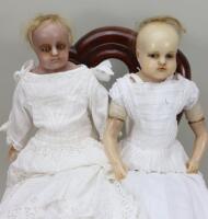 A pair of poured wax shoulder head dolls, English circa 1860,