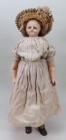 A wax over composition shoulder head doll, English circa 1850,