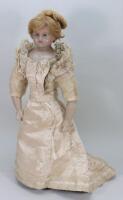 An impressive poured wax shoulder head bride doll,