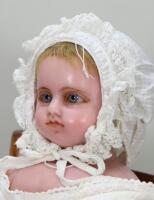 A Montinarie poured wax shoulder head doll, English 1870s,