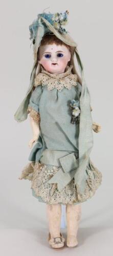 A small bisque head doll in original clothes, French circa 1890,