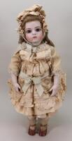 A reproduction Bru Jne bisque shoulder head artist doll,