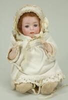 A small Recknagel bisque head ‘Pouty’ doll, circa 1915,