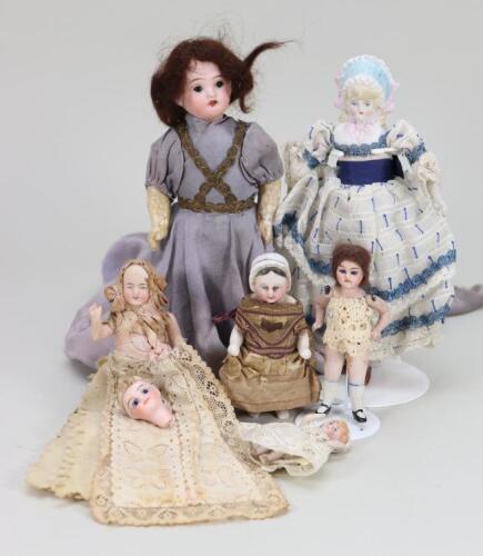 Sweet china Frozen Charlotte with moulded bonnet and other dolls,