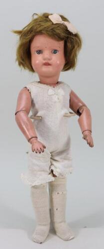 A Schoenhut ‘Miss Dolly’ carved wooden doll, American circa 1920,