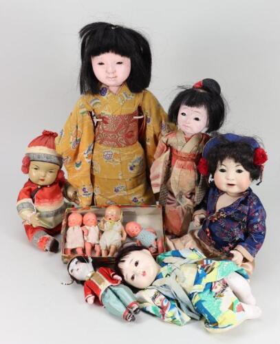 A Japanese papier-mache doll in original costume,