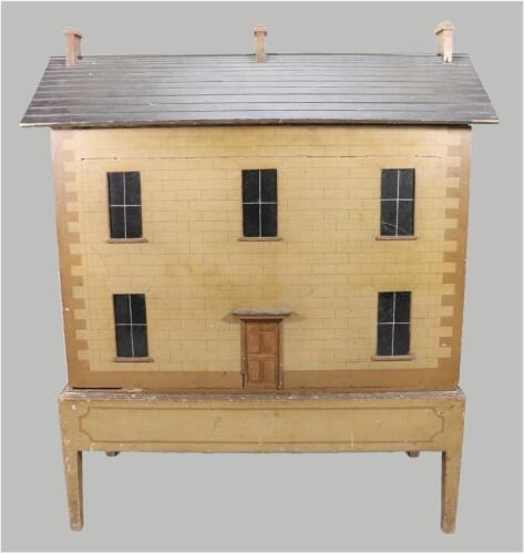 A fine and early English painted wooden dolls house on original stand, 1820s/30s,