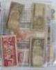 A folder of banknotes, including eighteen 10 Shillings, Bank of Indonesia, Japanese, Turkey