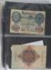 A folder of banknotes, including German, Italy, Egypt, Yogoslavia