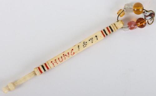 A rare bone turned lace bobbin inscribed W. Bull Hung 1871