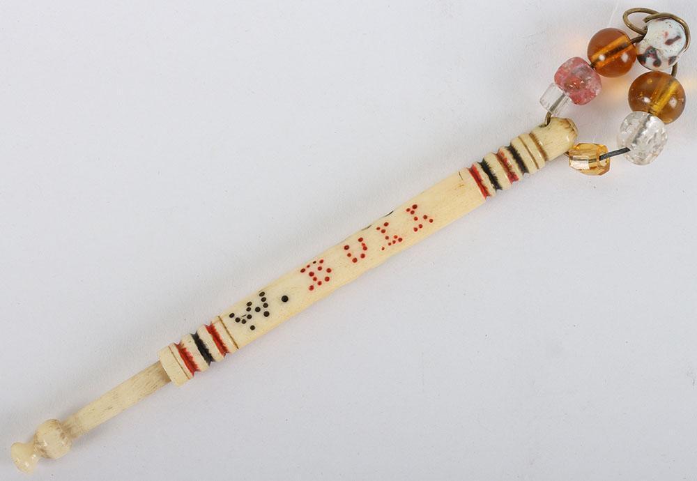 A rare bone turned lace bobbin inscribed W. Bull Hung 1871