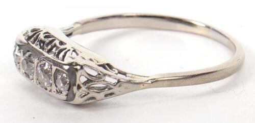 A white gold and four stone diamond ring