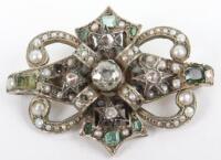 A diamond, peridot, pearl and topaz set brooch