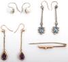A pair of gold (unmarked) and amethyst drop earrings