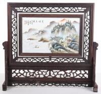 A late 19th/early 20th century Chinese porcelain handpainted table screen, on hardwood mount