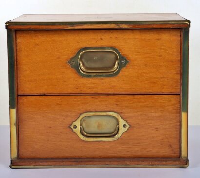 A campaign style mahogany two drawer miniature chest