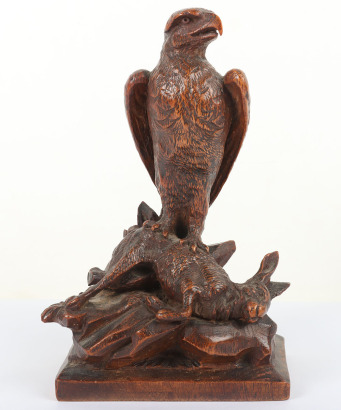 A Black Forest style wood carving of eagle and hare