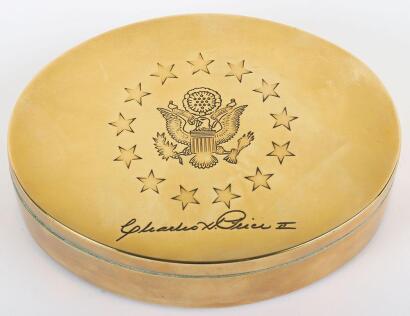 A US brass box with US Presidential seal and signed Charles H Price II