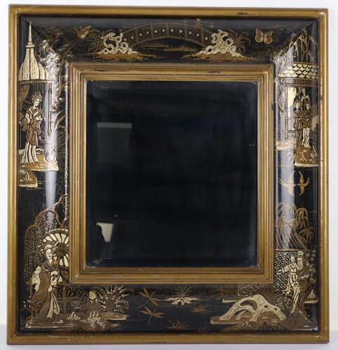 A 20th century Japanned bevelled mirror