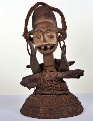 A carved African Ambete Reliquary figure mask helmet