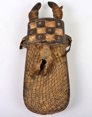 A Toma (Loma, Lorma) wooden ceremonial mask, elongated, painted white