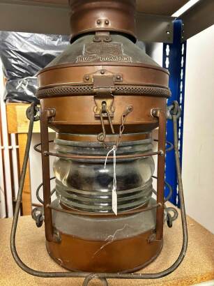 A vintage Not Under Command ships lantern