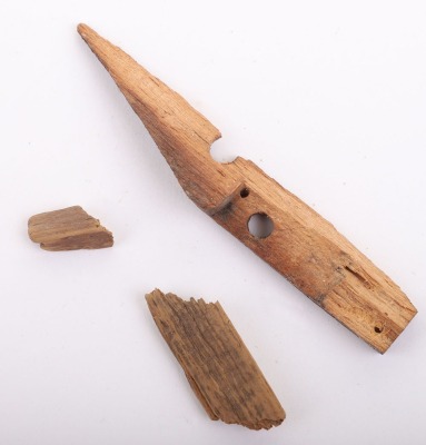 2 pieces of wood. One being a timber from Happy Day Mining Company owned by Wyatt Earp
