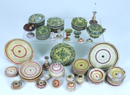 Two German turned wooden painted part Dinner services, 19th century,