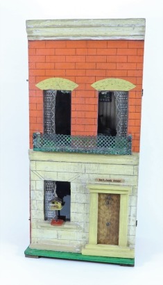 ‘Holly Bush House’ a Silber & Fleming painted wooden dolls house and contents, circa 1890,