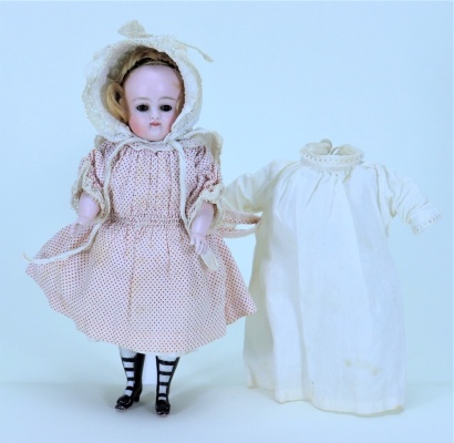 A rare Kestner all-bisque doll in original clothes, German circa 1900,