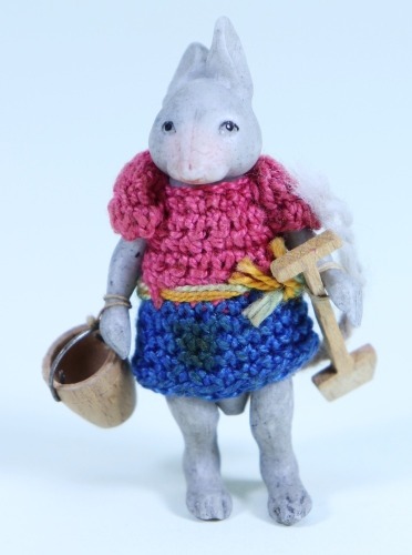 An all bisque Hertwig Mouse in crochet clothes, German circa 1910,