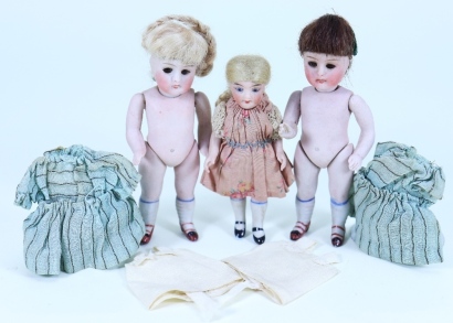 A pair of all-bisque dolls house dolls, German circa 1905,