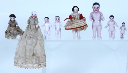 Eight miniature glazed china Frozen Charlotte dolls, German 19th century,