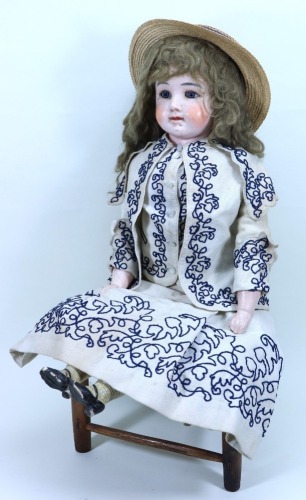 A large Sonneberg wax over composition shoulder head doll in original costume, German 1870s,