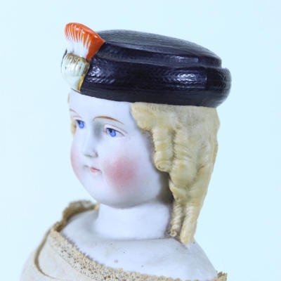 A rare Parian shoulder head doll with moulded hat, German 1860s, - 2