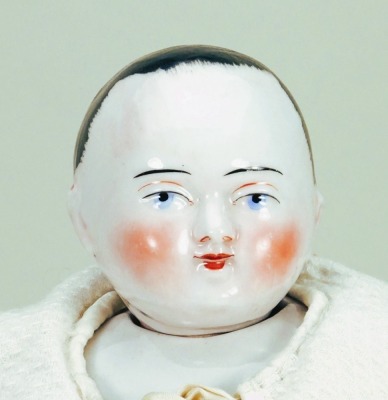 A rare glazed china Motschmann baby, German 1850s,