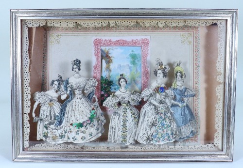 A diorama depicting fashionable ladies in glazed case,