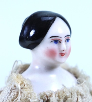 Rare small glazed china shoulder head doll on wooden jointed body, German circa 1845,