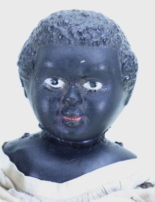 An interesting early black Gutta percher shoulder head doll, probably American, - 2