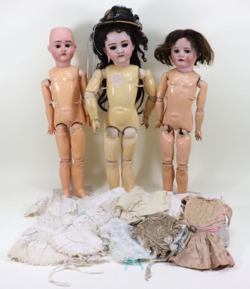 Three bisque head dolls and clothes, German circa 1910,