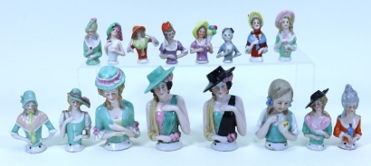 An A.M 390 bisque head girl doll and a collection of pin cushion half-dolls, German 1920s,