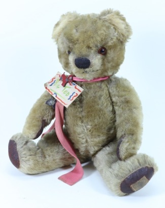 A post-war Chad Valley golden mohair Teddy bear and other soft toys,