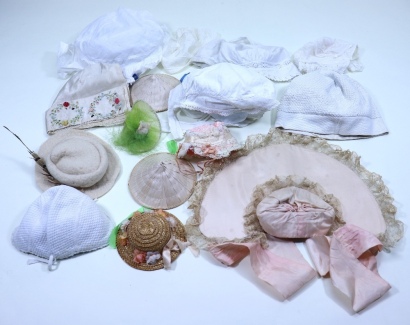 Collection of baby bonnets and dolls hats,