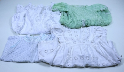 A collection of seven children’s dresses,