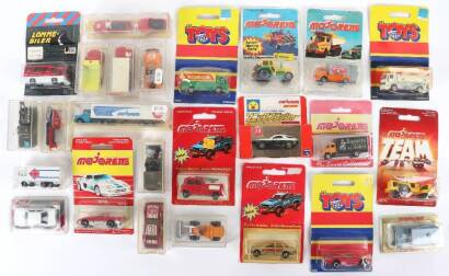 Twenty Five boxed Majorette cars and commercials in blister packs/perspex boxes