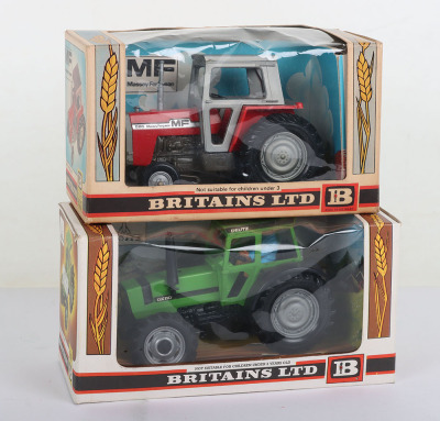 Two Boxed Britains Farm Tractors