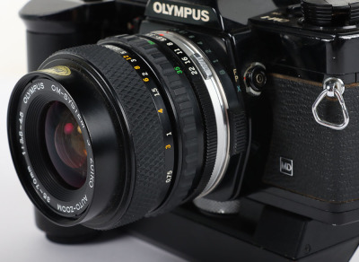 A Black Olympus OM-1 MD SLR Camera - 8